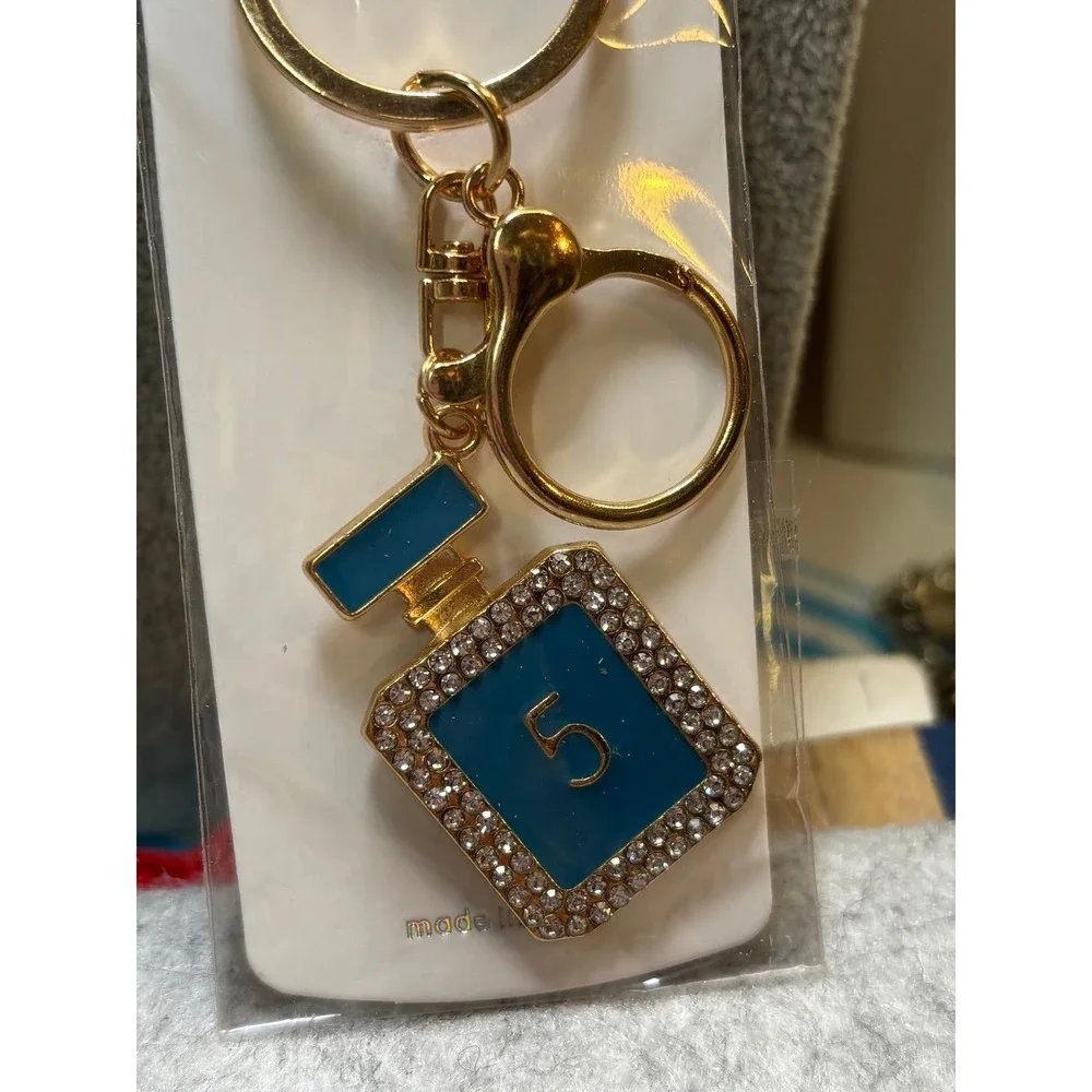 #5. Turquoise bag charm keychain perfume bottle-inspired.